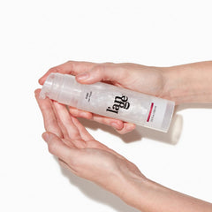 L'ANGE HAIR Posh Hair Polish bottle pour displays lightweight formula.