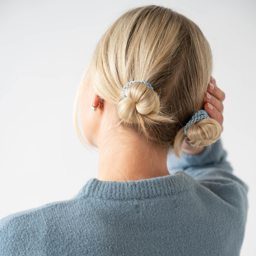 Closeup of braided polyester bands on L. Erickson hair ties