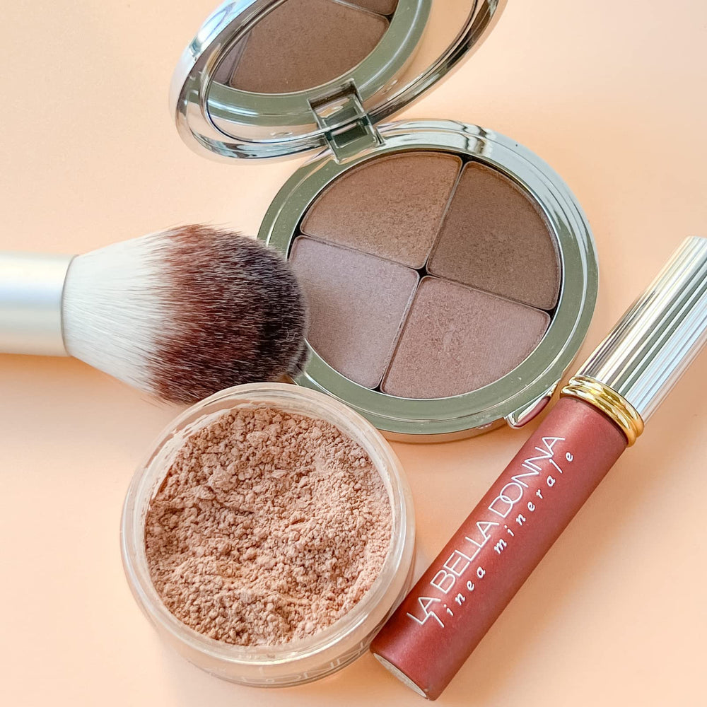 Applying La Bella Donna foundation with a brush for blending
