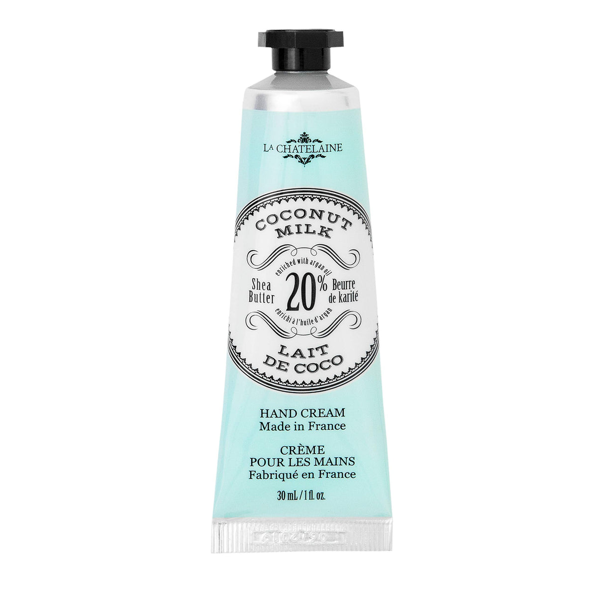 La Chatelaine travel-size hand cream in coconut milk tube for on-the-go hydration.