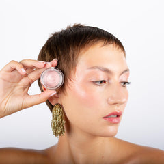 La Crique highlighter on the cheeks delivers a soft, buildable radiance.