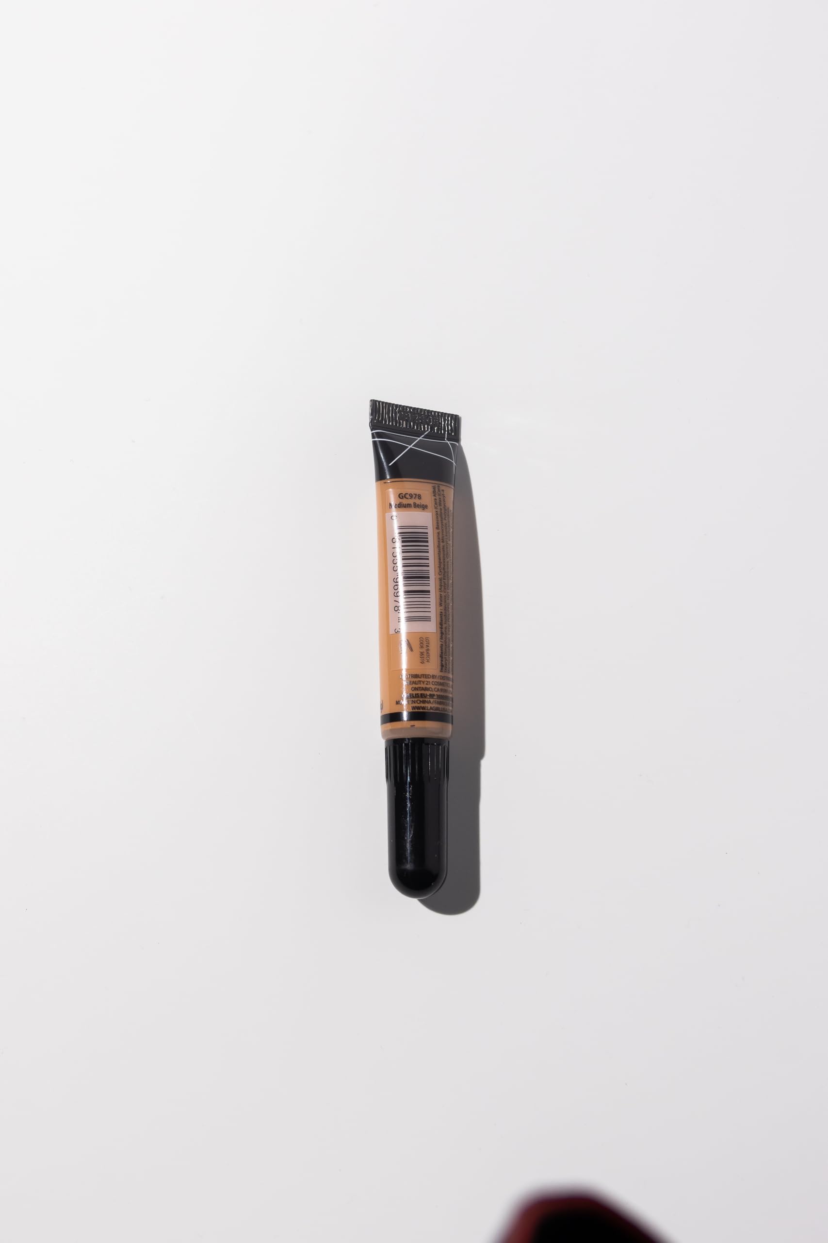 L.A. Girl Pro Concealer provides long-wear coverage with crease resistance.