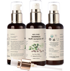 Close-up of LA GREEN Moringa Oil drop showing smooth texture for skin.
