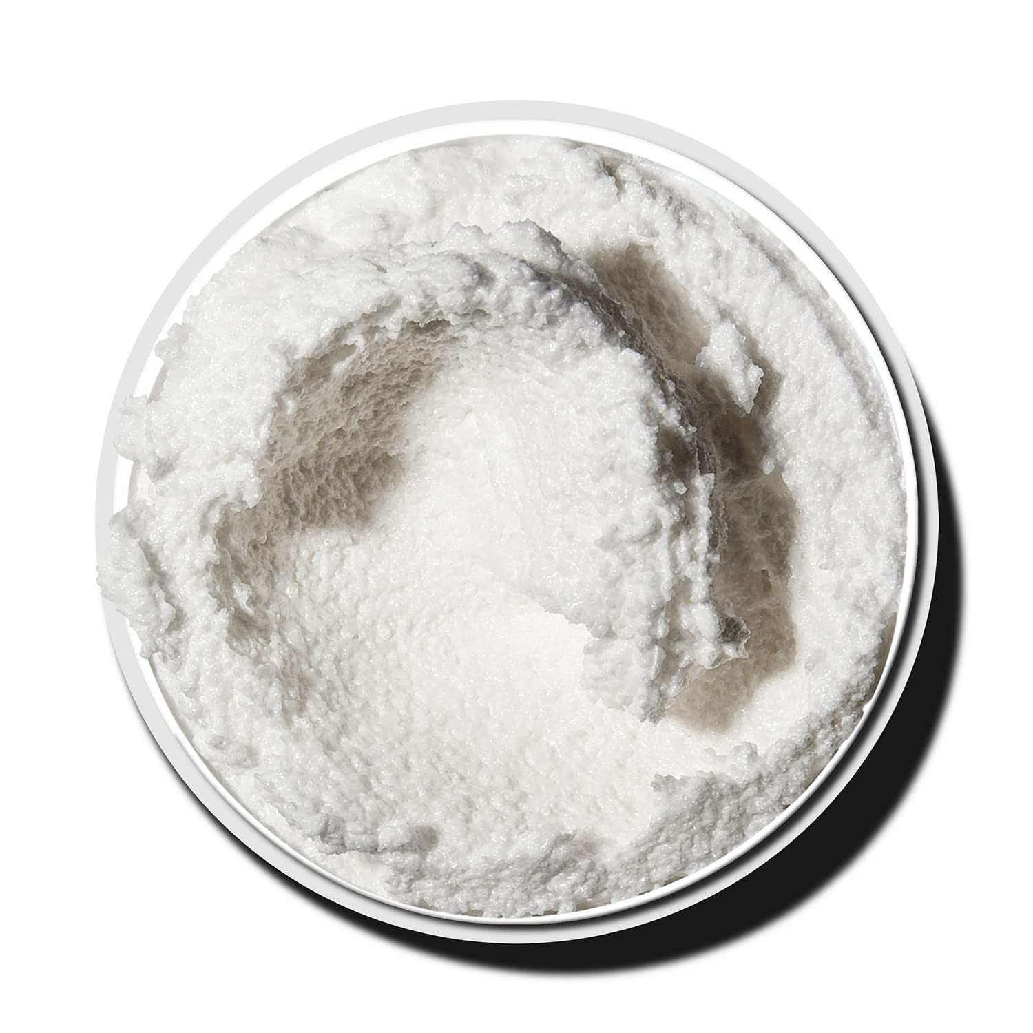 Application manuelle sur peau humide, texture cremeuse et agréable.