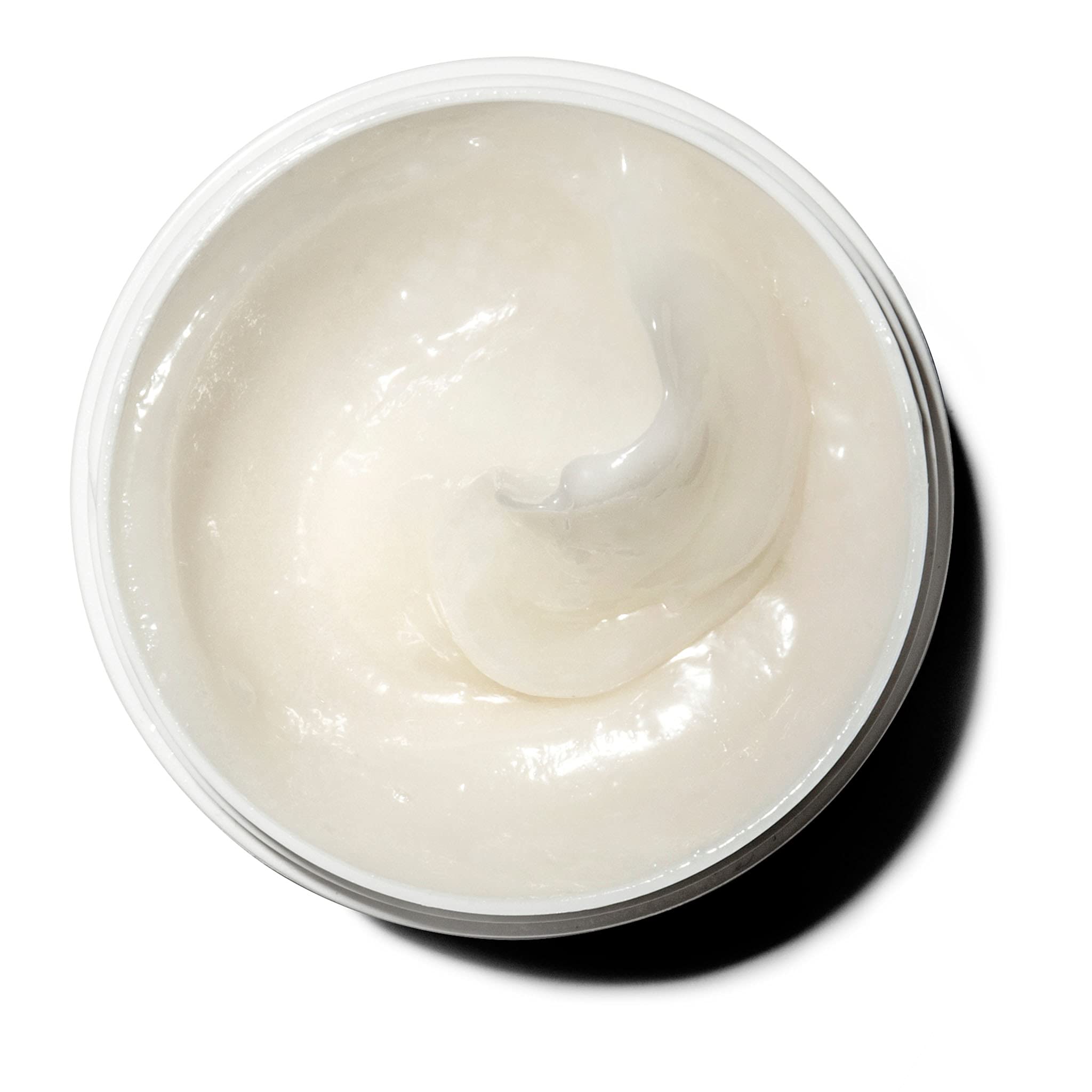 Jar being applied as creamy body moisturizer