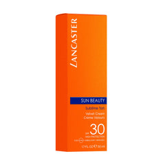 Hands applying Lancaster Velvet Touch Cream demonstrates smooth, even application for a radiant glow