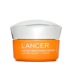 Lancer Instant Brightening Booster bottle close-up with premium packaging.