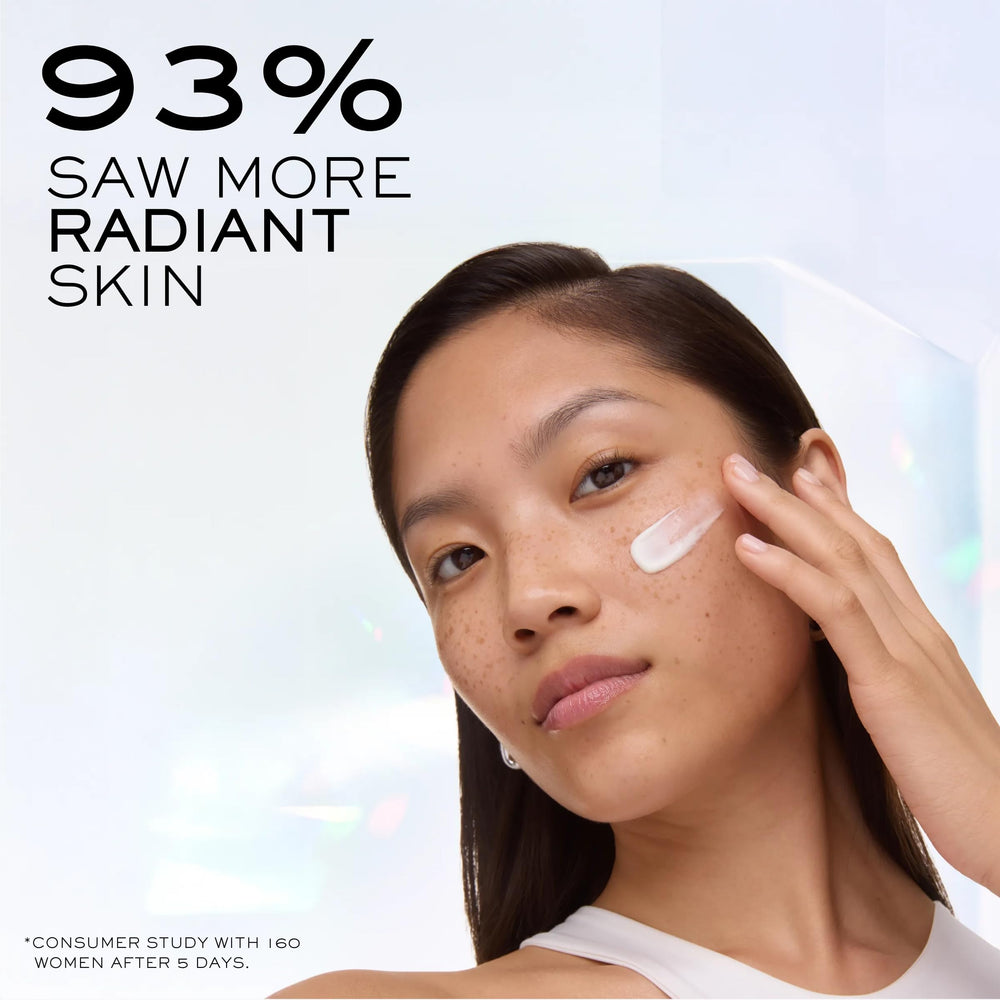 Lancôme Clarifique Milky Cream being applied, delivering glow and balanced hydration.