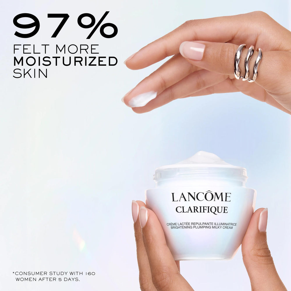 Lancôme Clarifique Milky Cream spread on hand, showcasing silky texture for smooth skin.