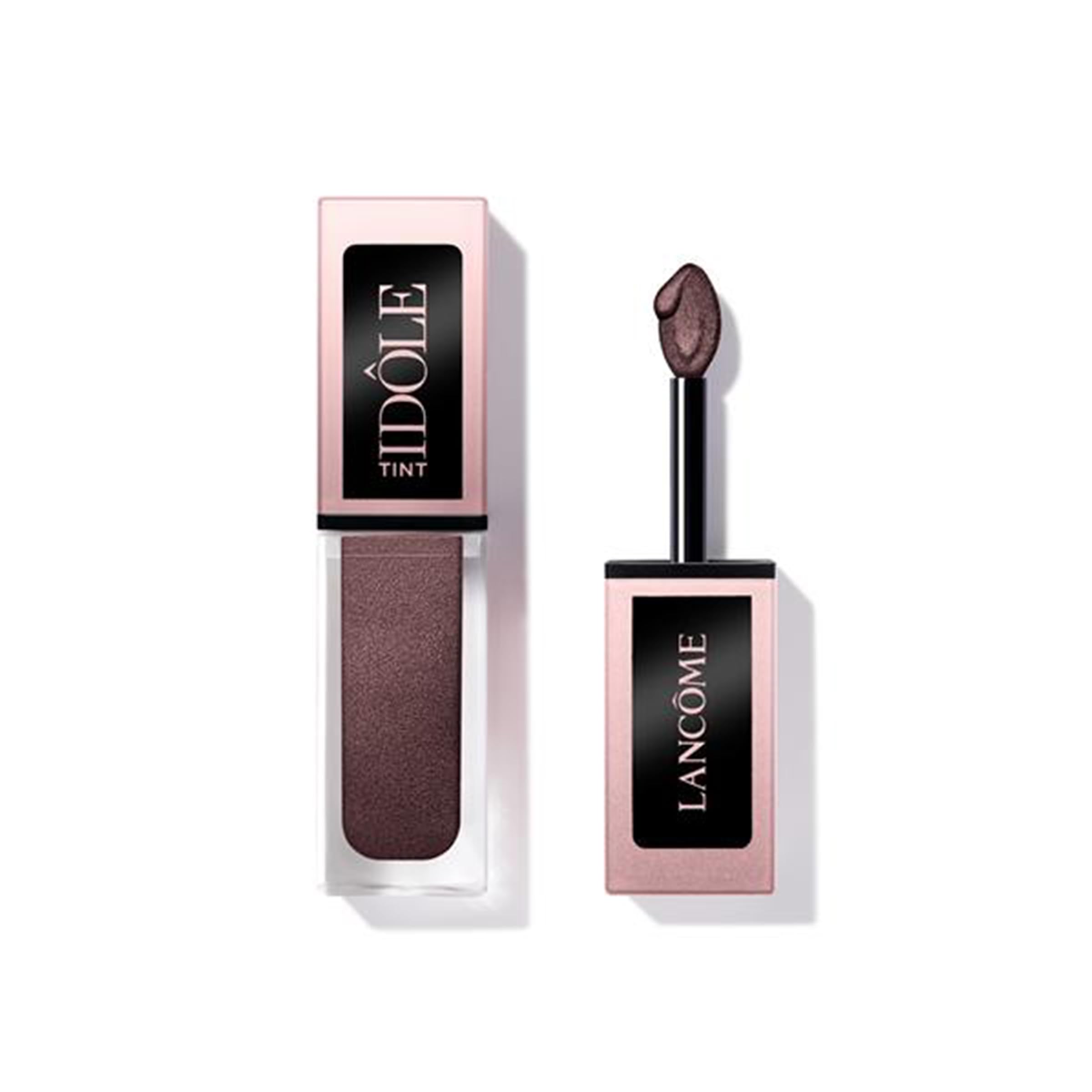 Lancôme Idôle Tint bottle close-up with iridescent warm brown shade for versatile looks.
