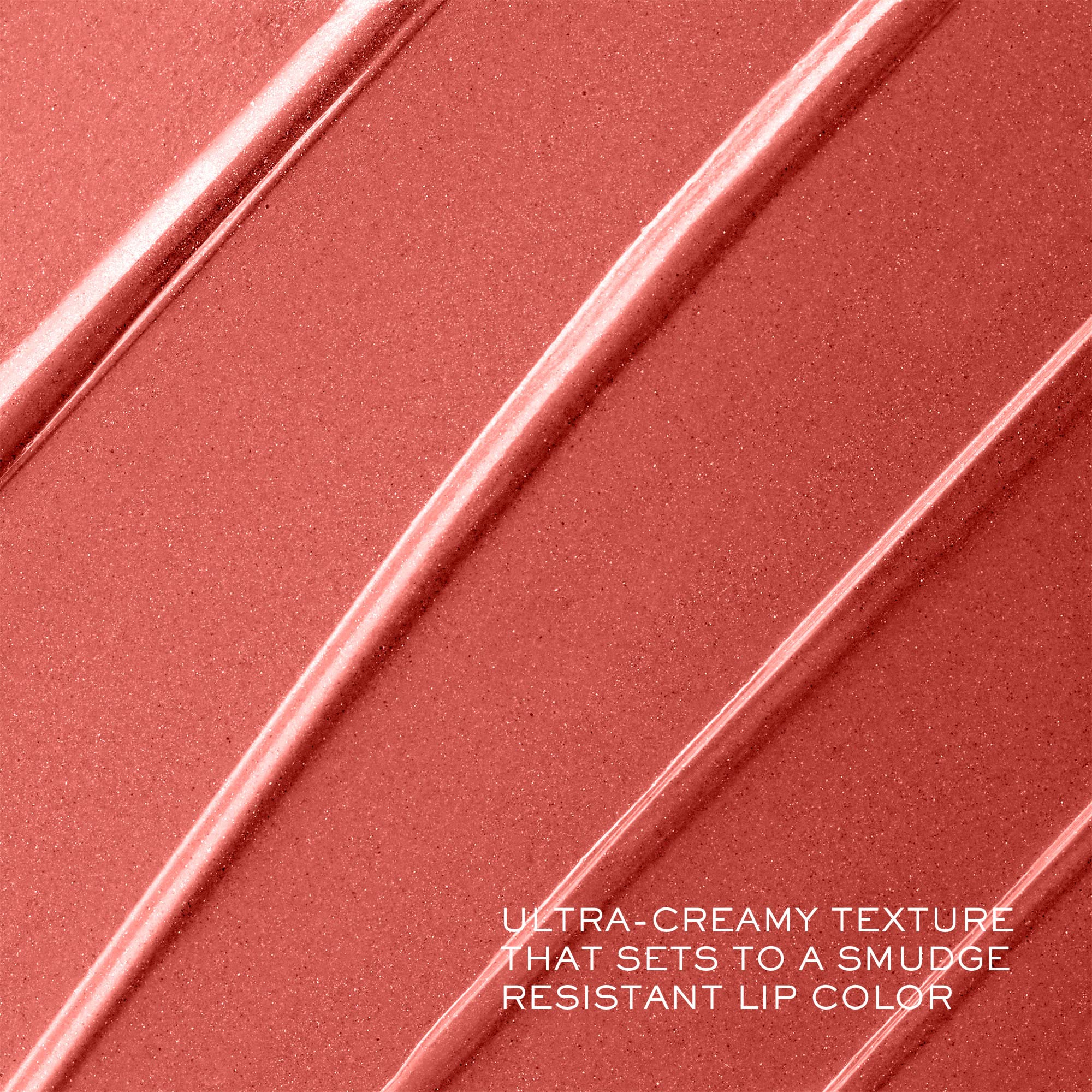 Close-up of Lancôme lipstick tip gliding across lips