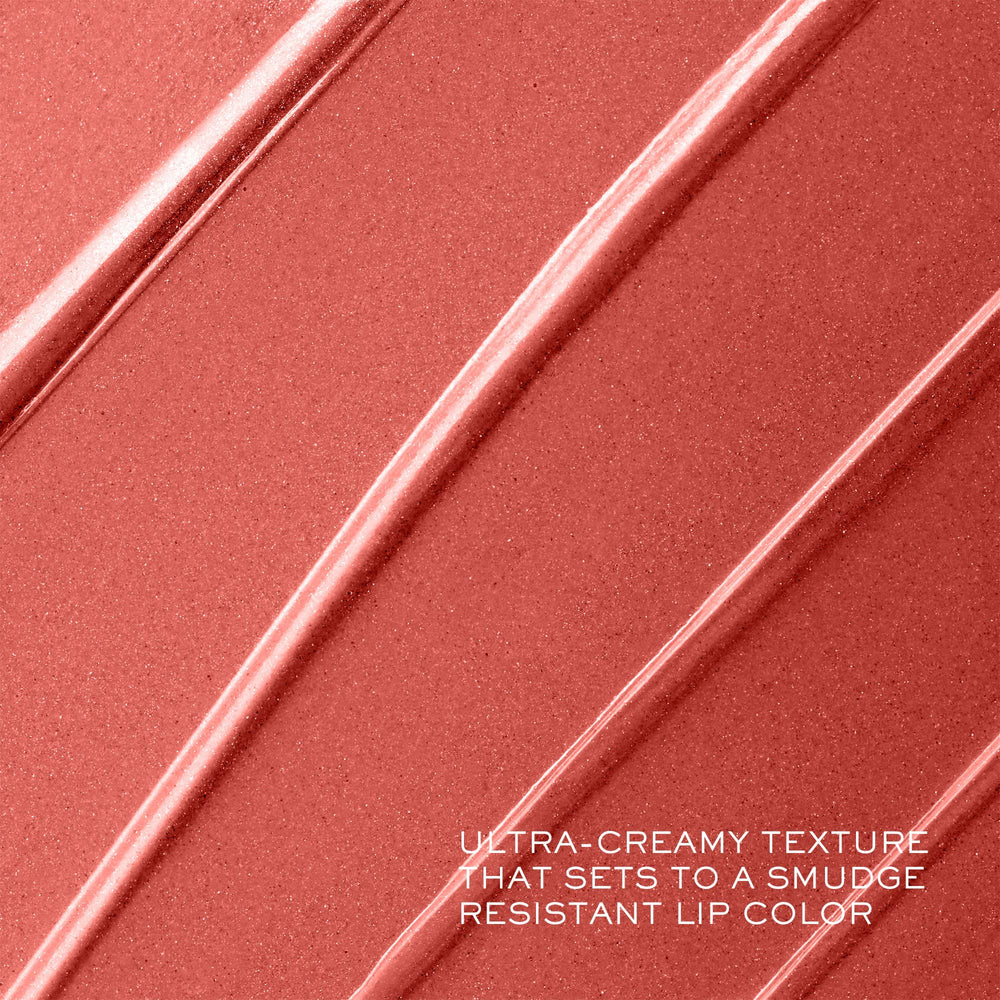 Close-up of Lancôme lipstick tip gliding across lips