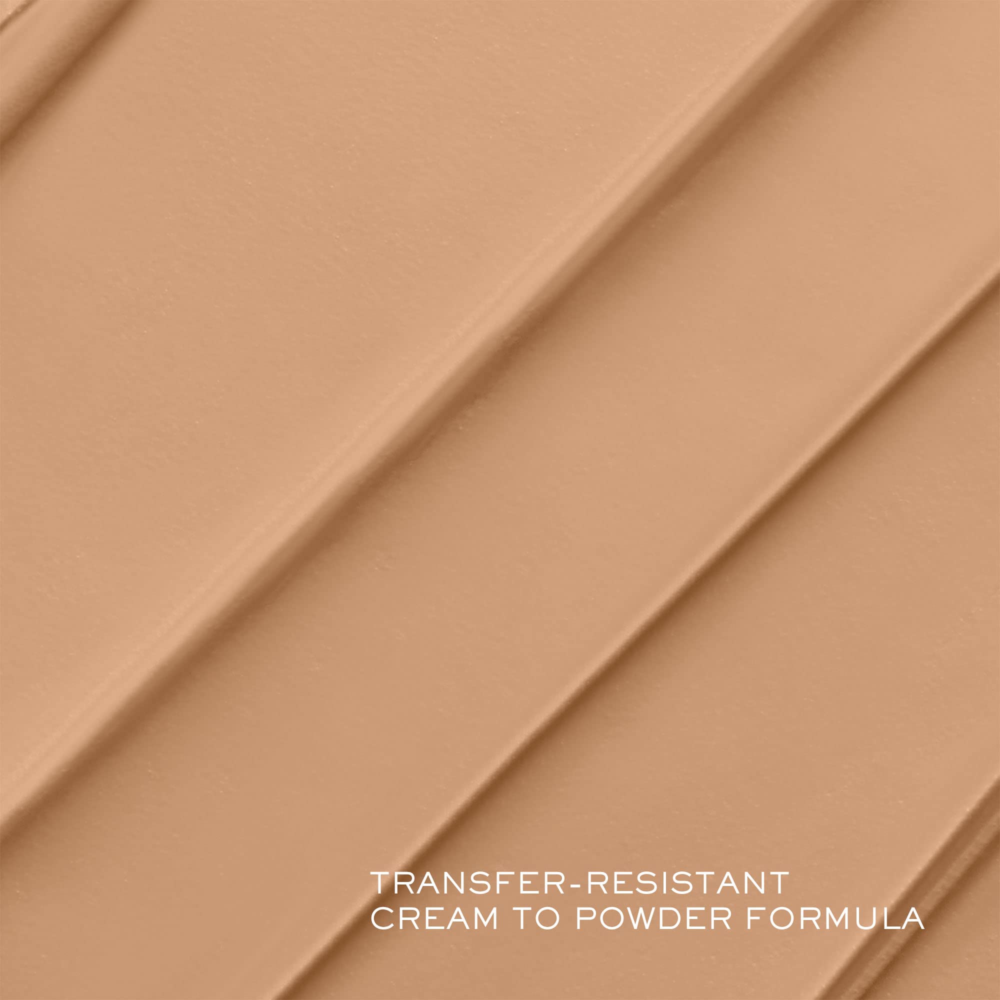 Lancôme Teint Idôle texture close-up shows creamy formula blending into skin.