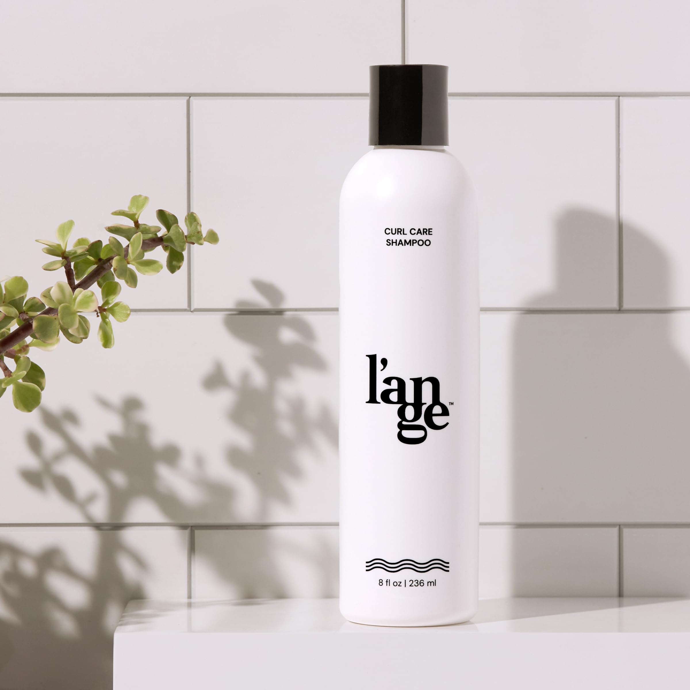L'ANGE HAIR Curl Care Gentle Shampoo wet-hair close-up shows cleansing action.