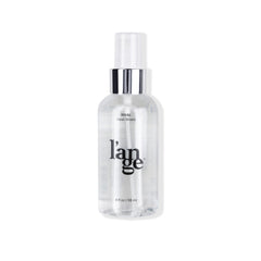 L'ANGE RIVAL Heat Shield bottle close-up with UV protection for color.