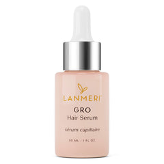 Lanmeri vegan hair growth serum bottle closeup showing cruelty-free formula for healthier hair.