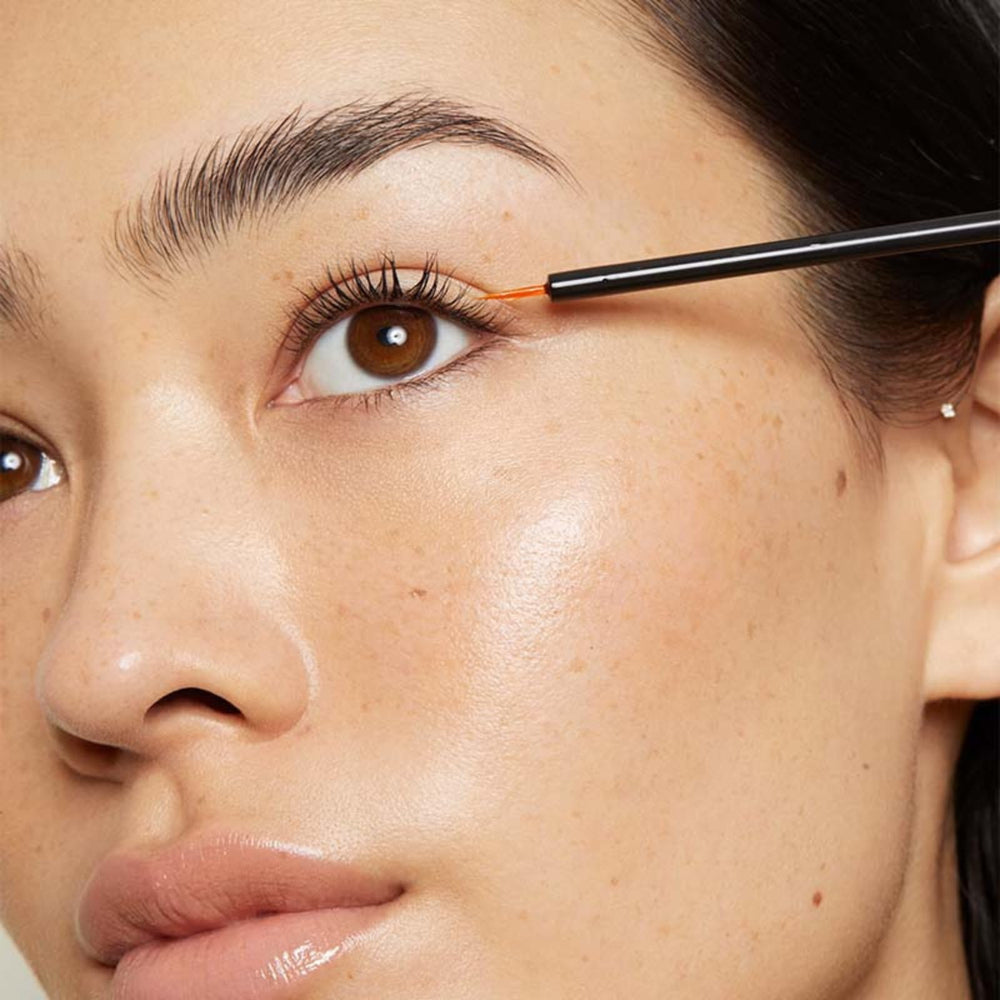 LashFood serum drops on lash line demonstrating easy nightly use
