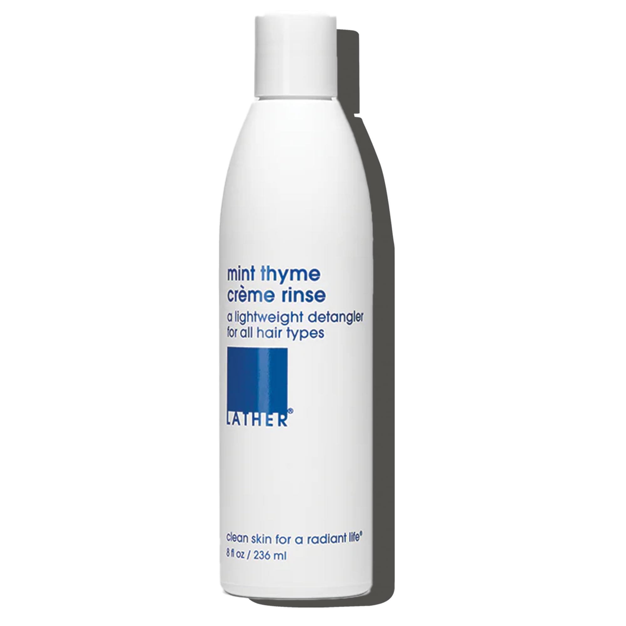 LATHER Mint Thyme Crème Rinse bottle ready for daily detangling.