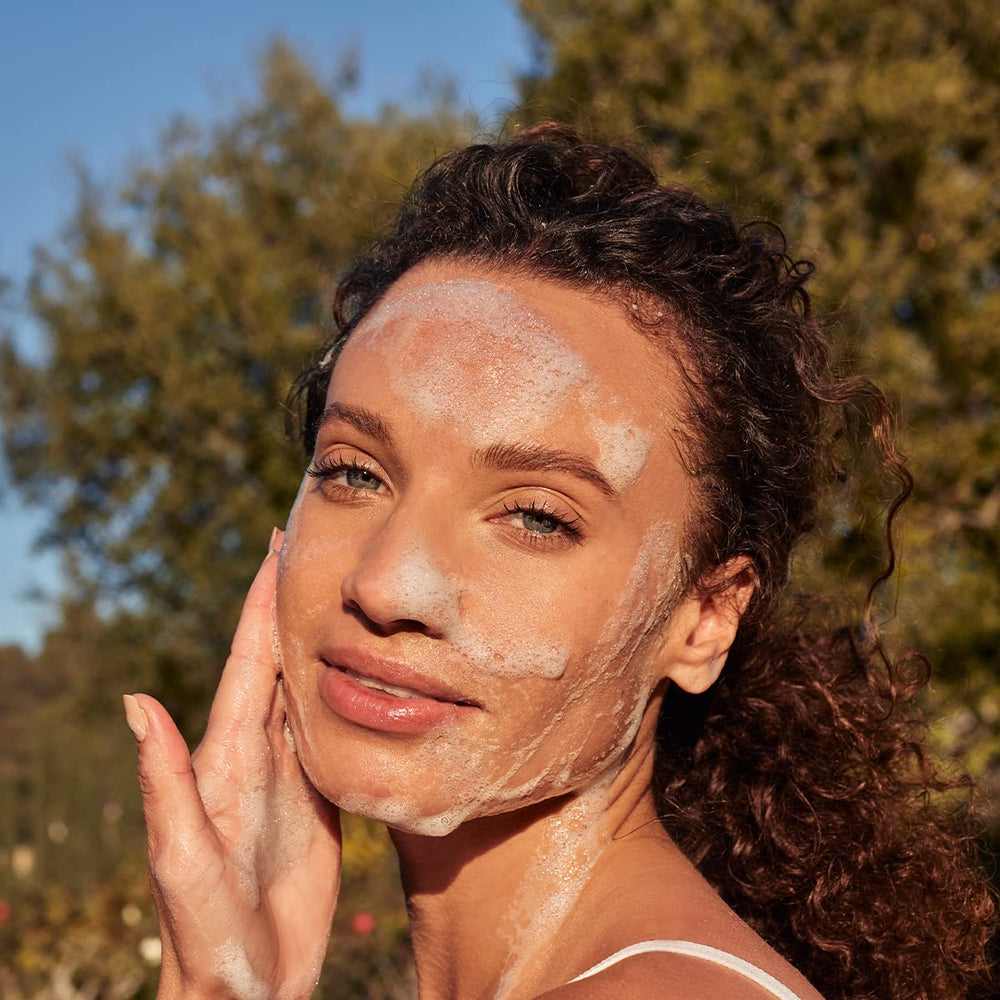 LATHER Ultra Mild Face Wash ingredients close-up highlights coconut oil, shea butter, and rose.