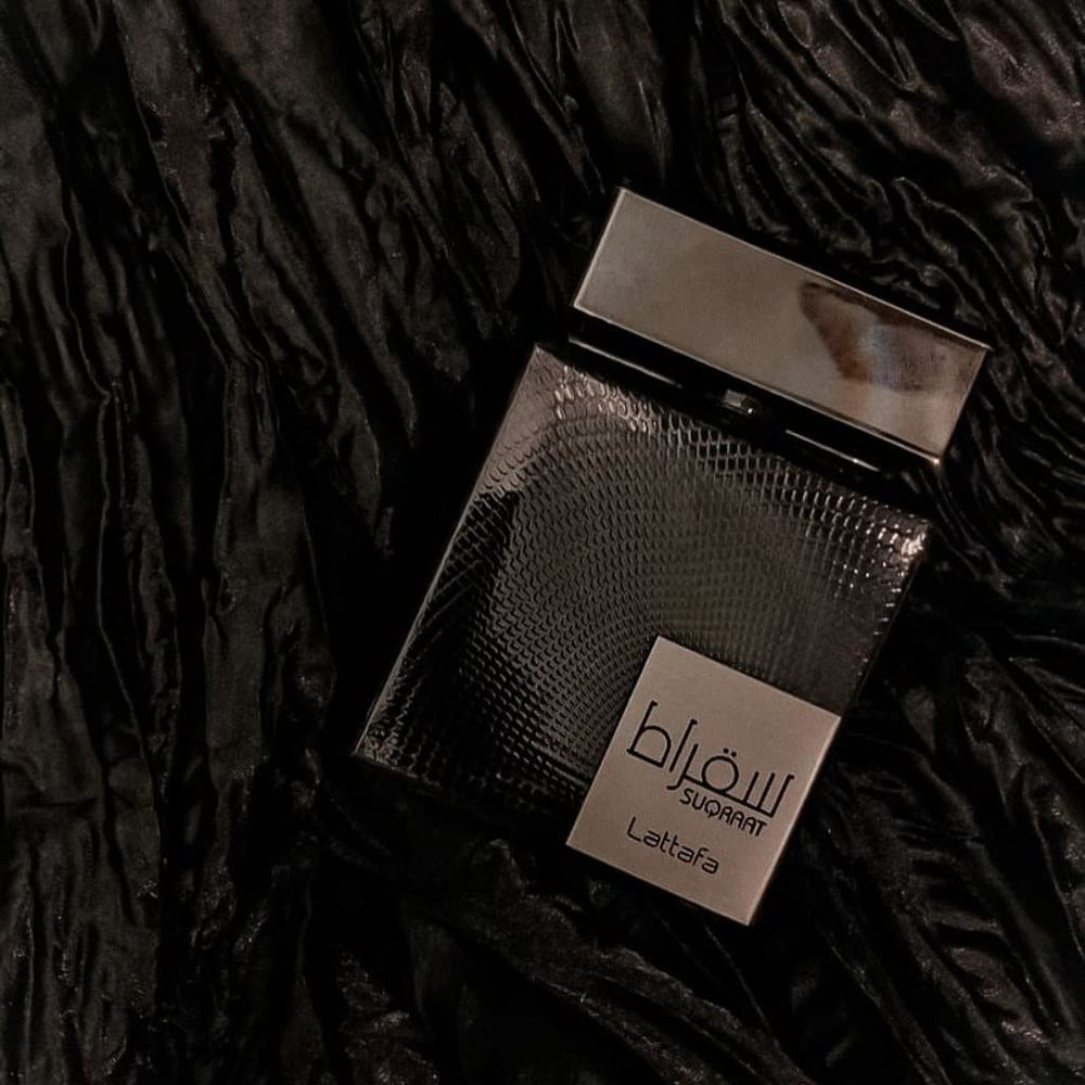 Lattafa Suqraat bottle angled shot, hints at warm musk and lavender allure.