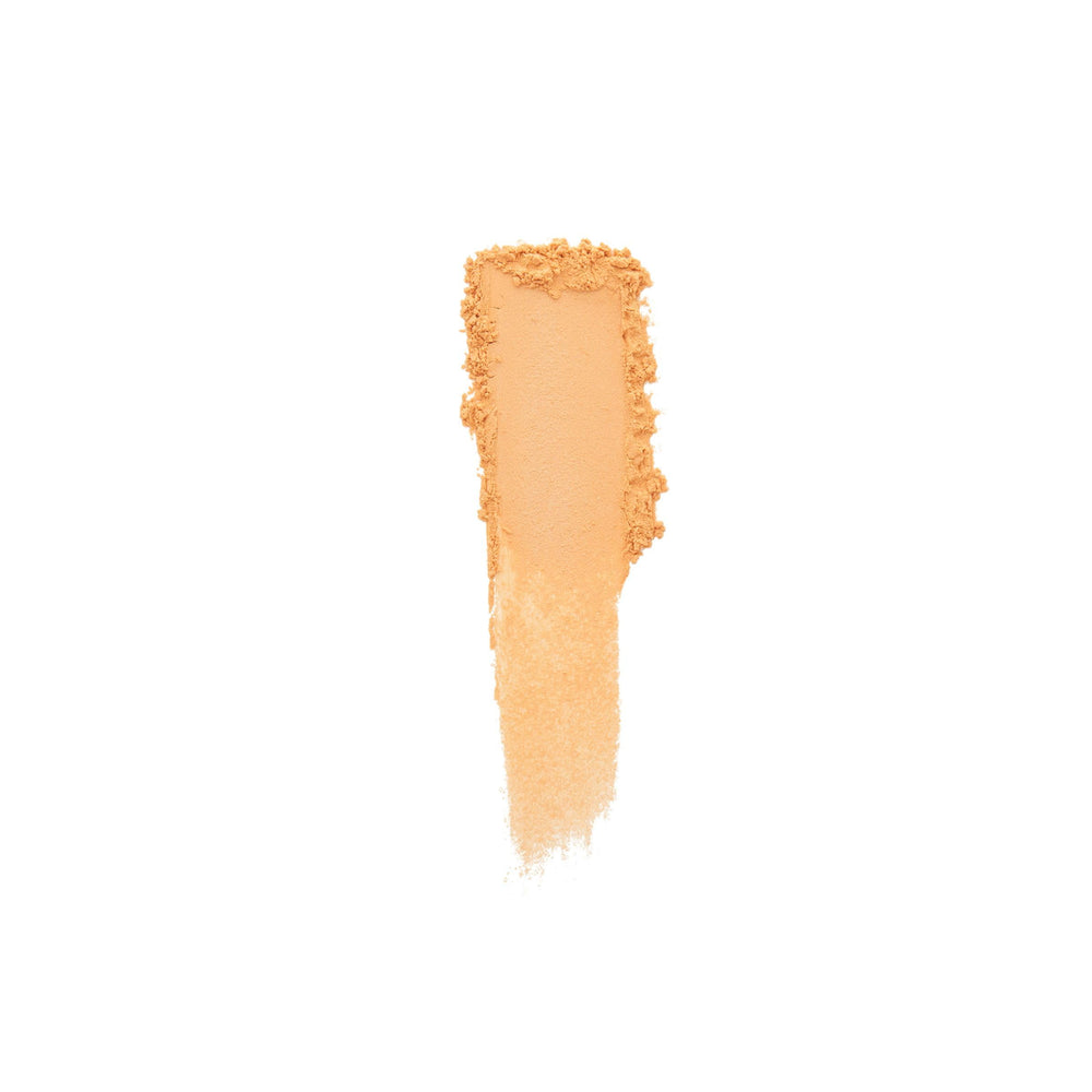 Laura Mercier Secret Brightening Powder texture close-up shows radiant pearls.