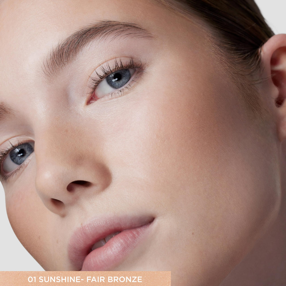 Laura Mercier Tinted Moisturizer Bronzer texture close-up showing weightless finish