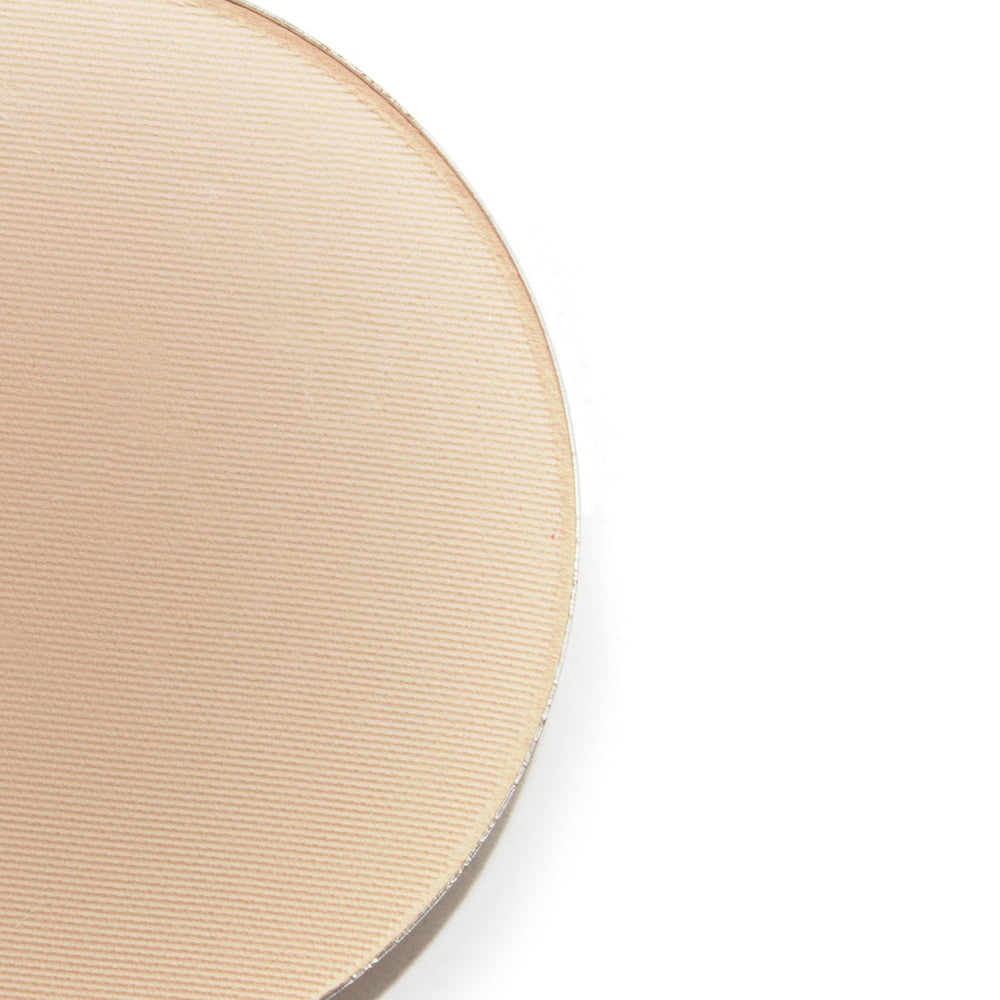 Lauren Brooke Cosmetiques pressed foundation being applied with a brush for easy blending and light coverage.