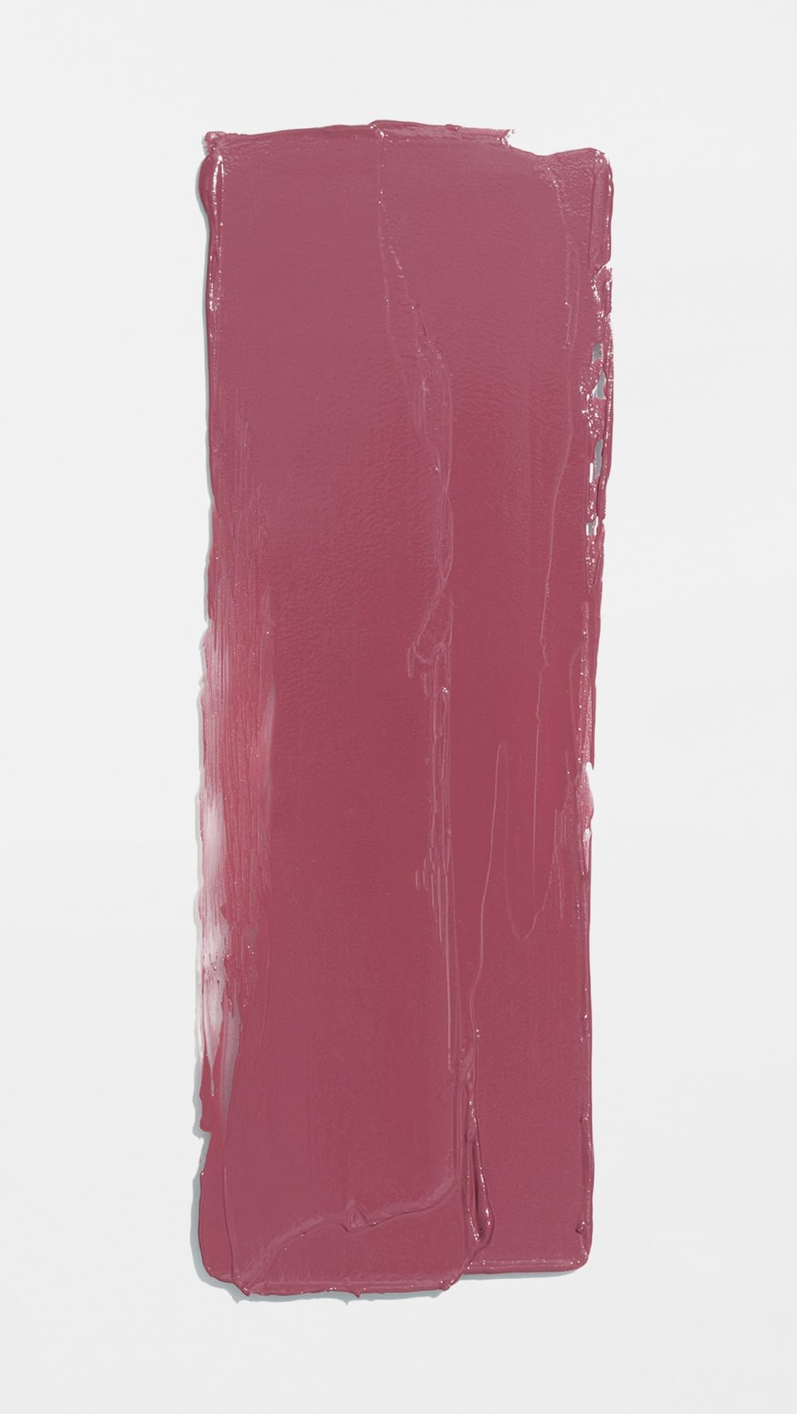 Applying Lawless Minx for smooth, hydrated lip color.