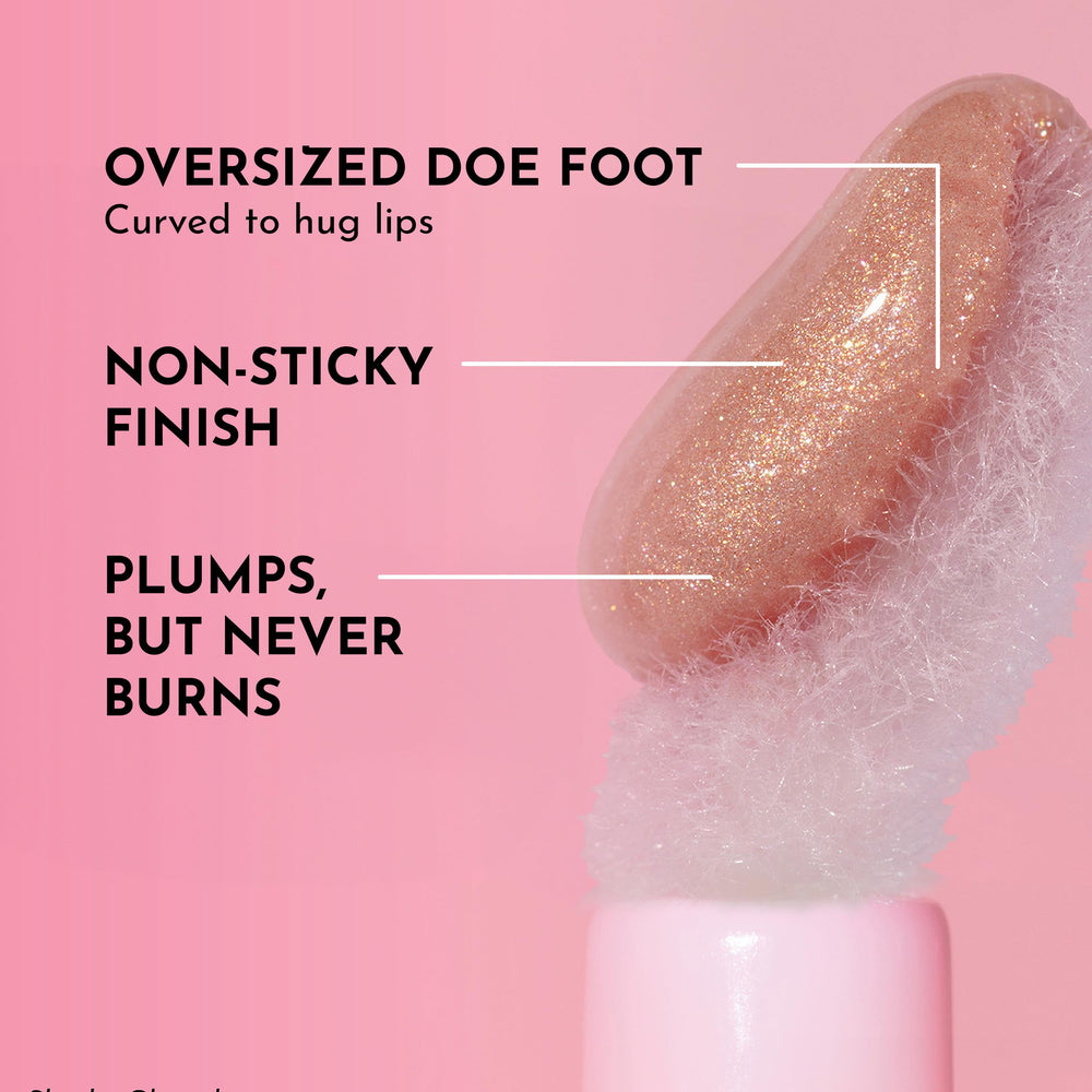 Lawless Glazed gloss on lips for glass-like shine and smooth texture.