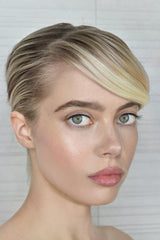 Le Metier De Beaute creme fresh tint on lips for hydrating color.