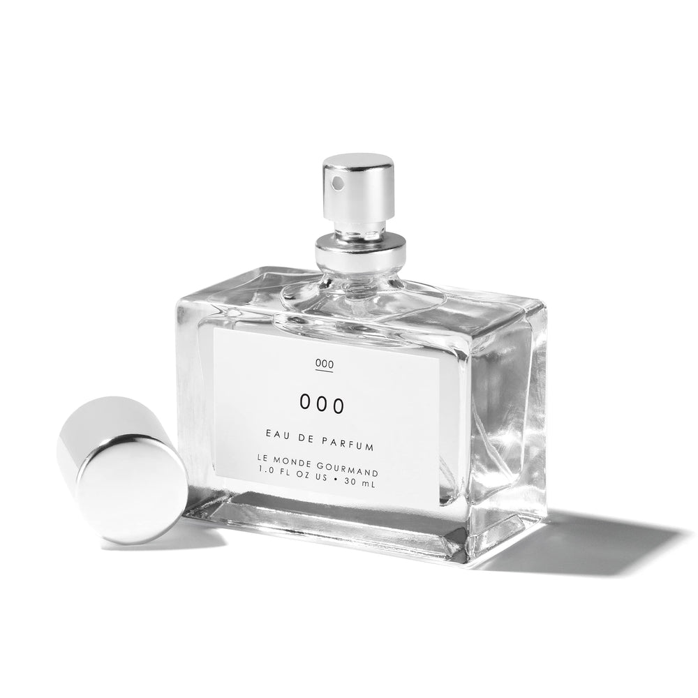 Le Monde Gourmand 000 spray on wooden surface conveys versatile everyday scent