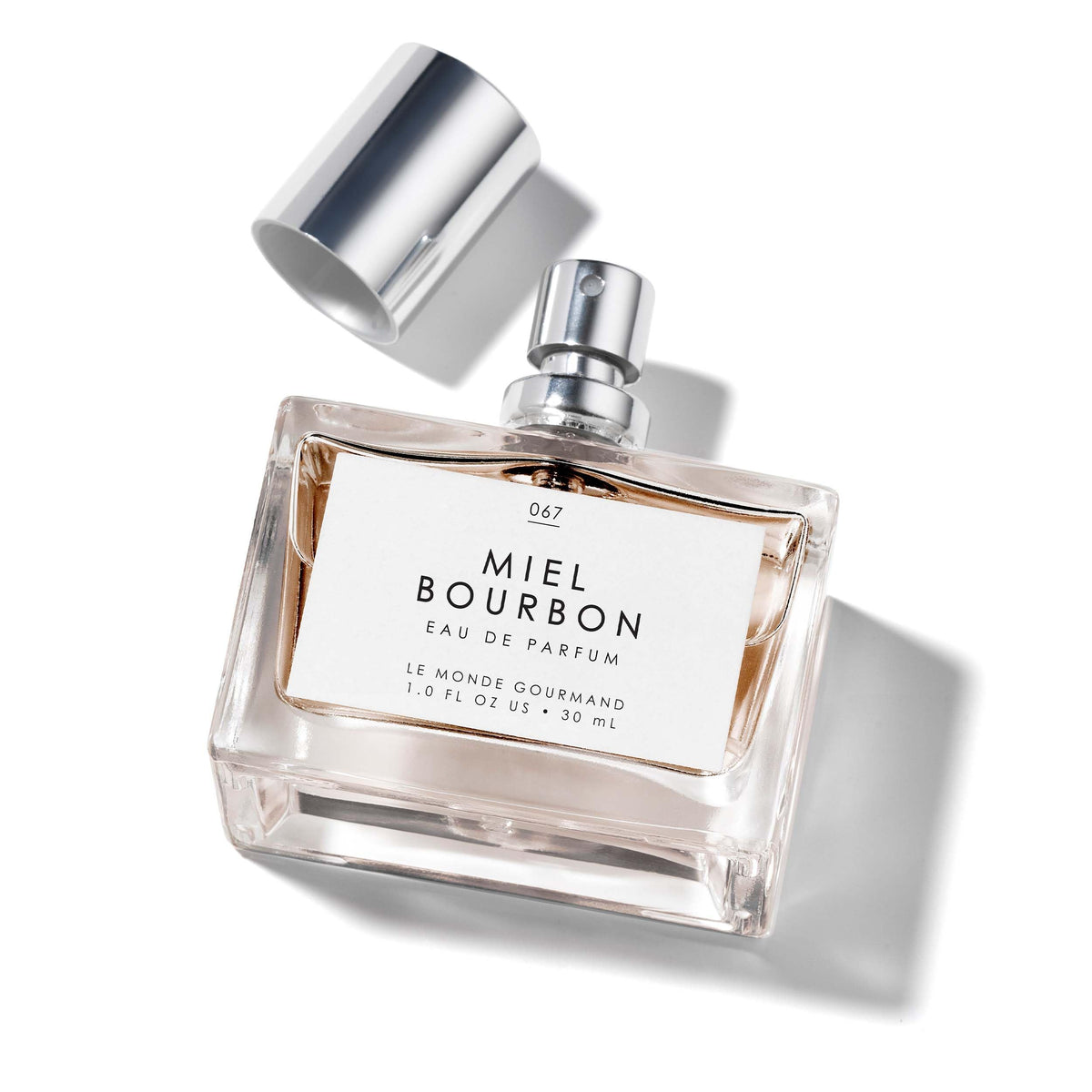 Le Monde Gourmand Miel Bourbon EDP bottle showing warm vanilla and honey notes for cozy evenings.