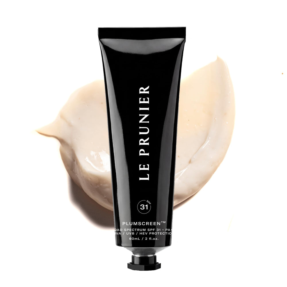 Le Prunier Plumscreen bottle closeup showing mineral sunscreen with Plum Superfruit Complex for antioxidant protection.