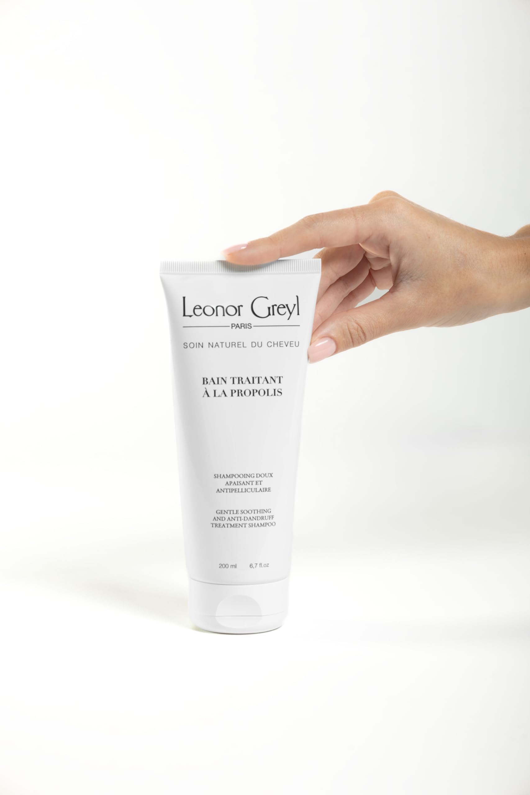 Leonor Greyl application and rinse showing scalp massage for even cleansing