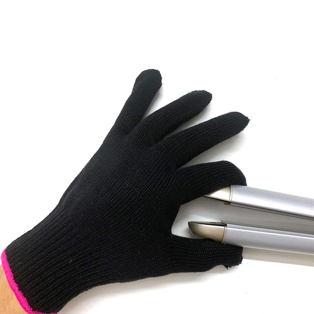 Lessmon heat resistant glove on hand during hair styling for protection.