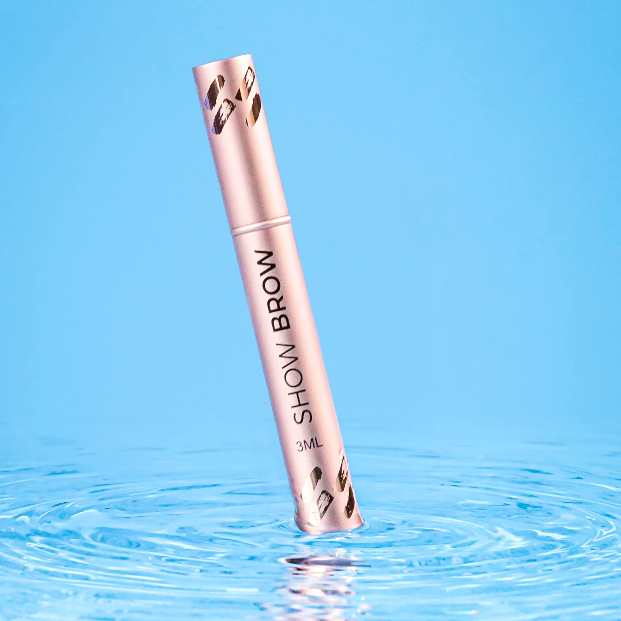 LeVaye Show Brow Serum applicator dipped into the bottle, ready for nightly use