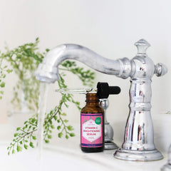 Dropper application scene showing precise dosing for Leven Rose serum