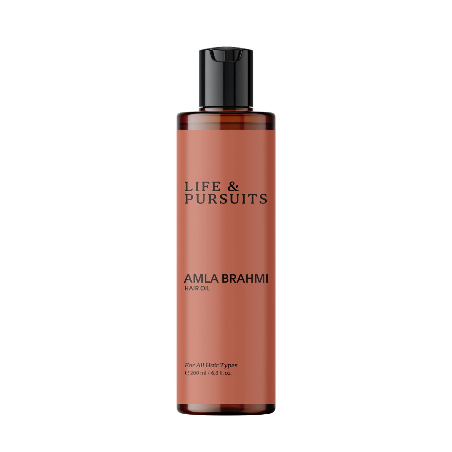 Life & Pursuits Amla Brahmi Oil bottle pouring for scalp nourishment
