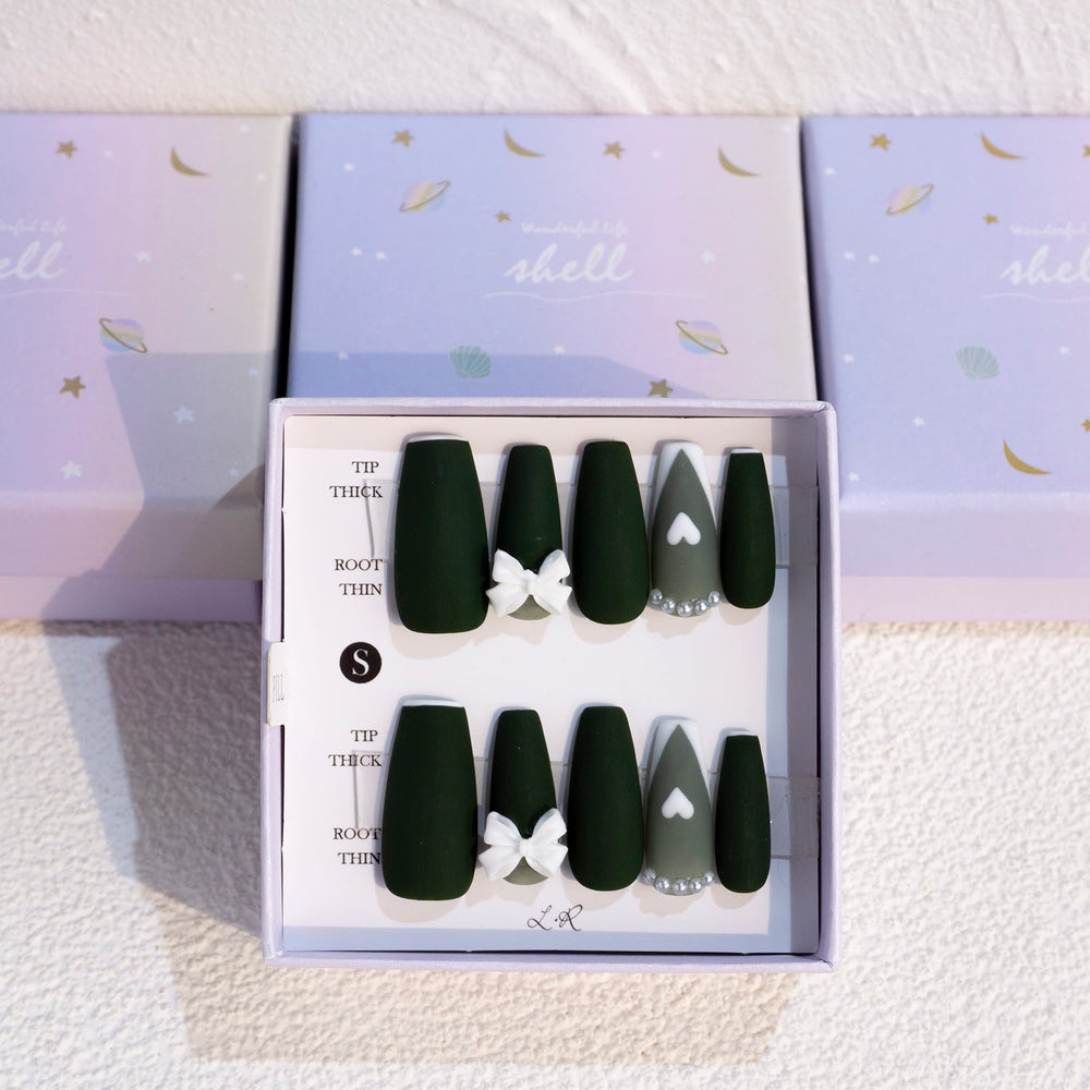 Light Rain medium nails design closeup shows hand-painted artistry for a luxe look.