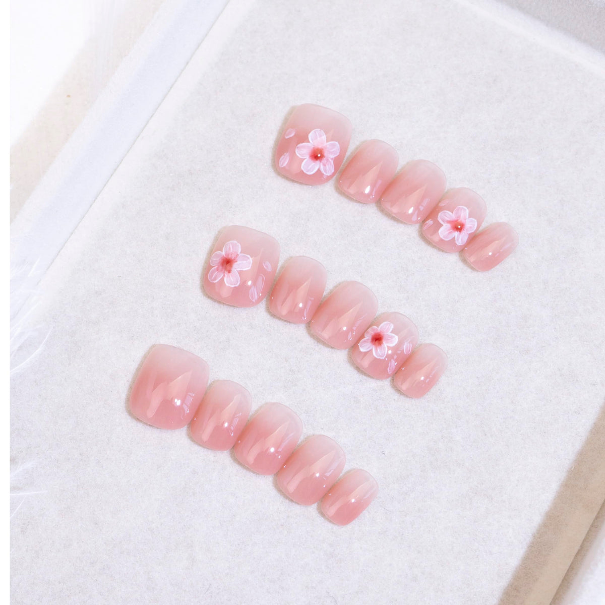 Light Rain medium-size press-on nails in a studio shot with a salon-quality finish.