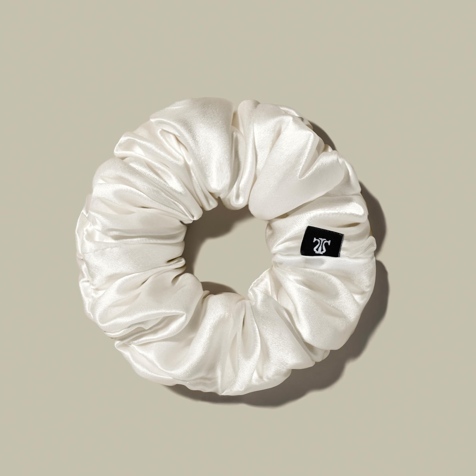 LilySilk silk hair scrunchie with silk-shine finish reduces snagging and frizz.