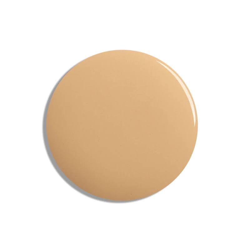 Lisa Eldridge seamless skin tint application dots across cheeks and forehead for even, buildable coverage.