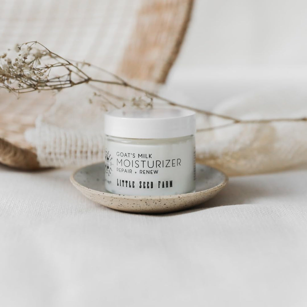 Little Seed Farm goats milk face moisturizer glass jar emphasizes eco-friendly packaging.