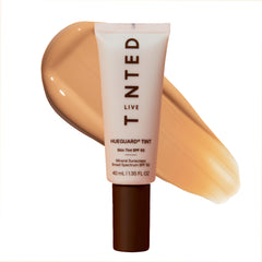 Live Tinted Hueguard Skin Tint 08 bottle close up shows lightweight mineral SPF 50 protection and radiant finish