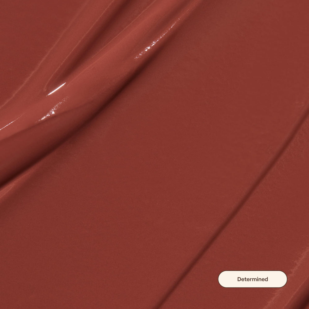 Live Tinted Huelip applicator close-up for precise, weightless matte application.