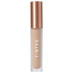 Live Tinted Hueskin Serum Concealer bottle close-up showing smooth, buildable coverage.