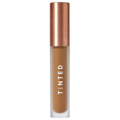 Live Tinted Hueskin Serum Concealer bottle close-up showing buildable coverage for dark circles