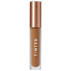 Live Tinted Hueskin Serum Concealer packaging close-up showing premium design and shade readiness.