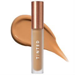 Live Tinted Hueskin Serum Concealer shade 10 swatch on arm demonstrates buildable coverage.