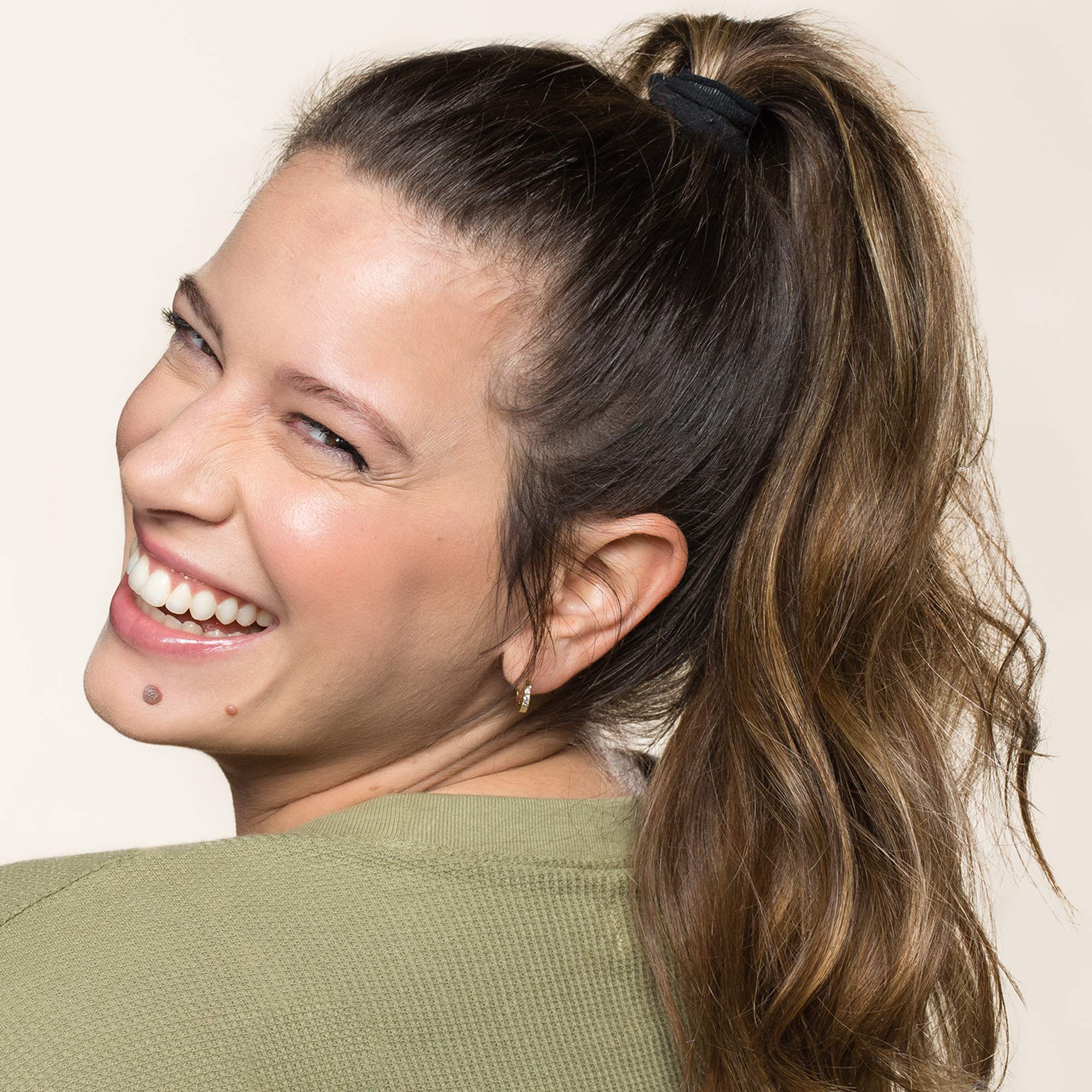 Living Proof Style Lab Control Hairspray can angled for precise mist delivery.